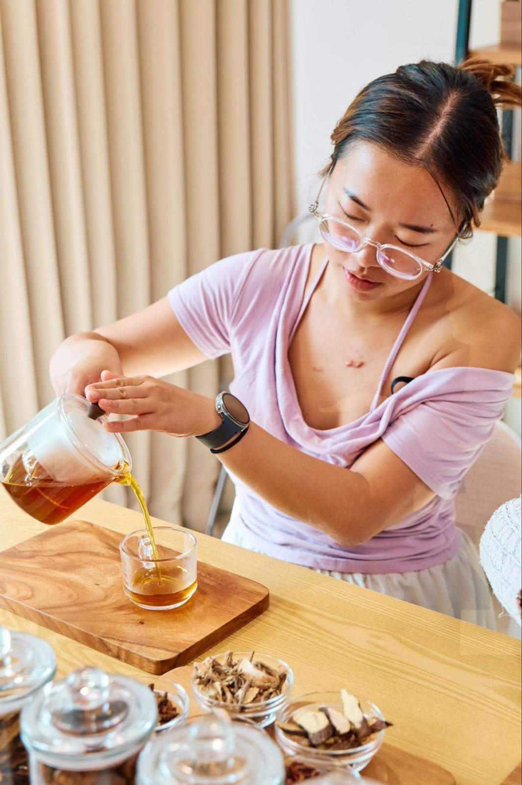 A guest pouring Travel Reset tea