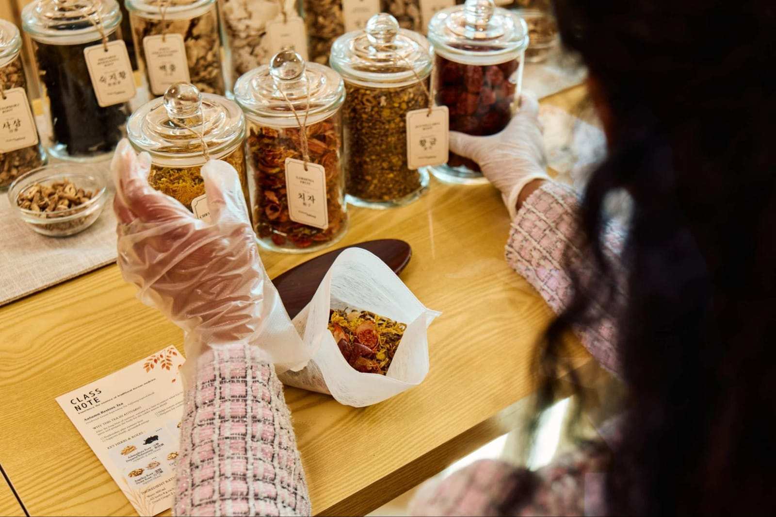 A guest choosing herbal ingredients